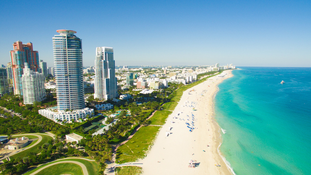 miami florida usa beach and ocean tall buildings green park and blue sky