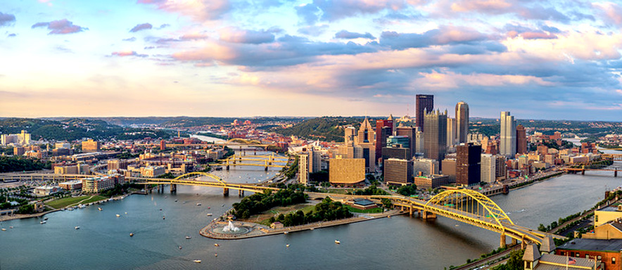 Pittsburgh Pennsylvania city river and bridges cloudy pastel sky