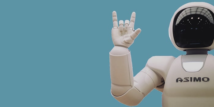 Robot with hand out on blue background
