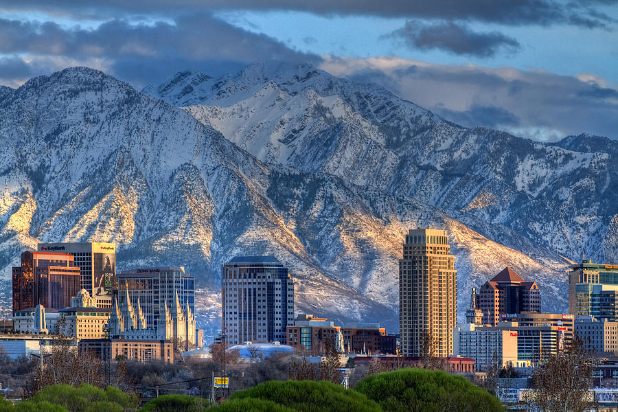 salt lake city utah usa trees tall buildings mountains snow clouds sky