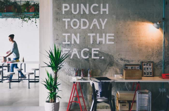 cafeteria setting with wall writing, punch today in the face