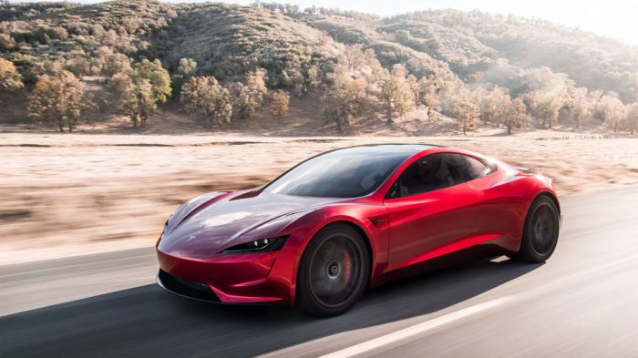 Tesla Roadster red driving fast