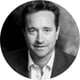 black and white photo, man, white shirt, black suite, brown hair