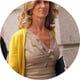 soman, beige dress, yellow cardigan, blong curly hair