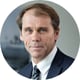 old man, white shirt, black suit, tie with the strips, brown hair
