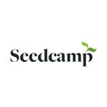 SeedCamp logo, white background, black letters, two leaves on the right top side