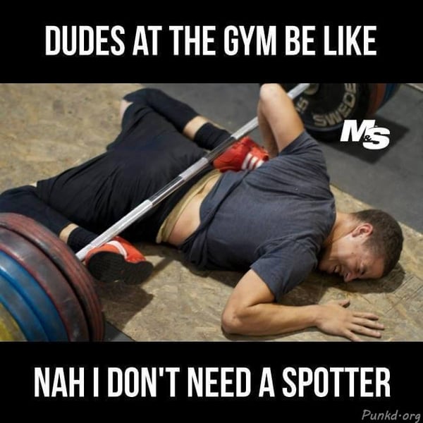 man on floor with weights on him