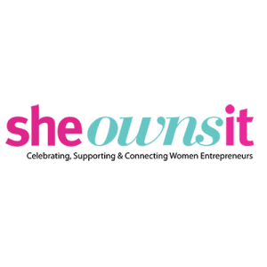 She Owns It logo with pink and green letters on a transparent background.