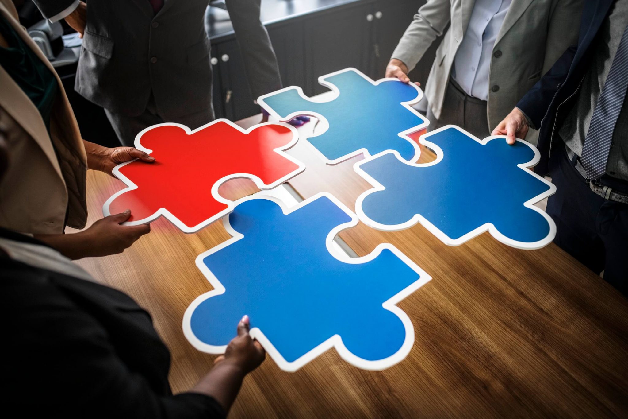 Photo by rawpixel.com from Pexels team with puzzle pieces