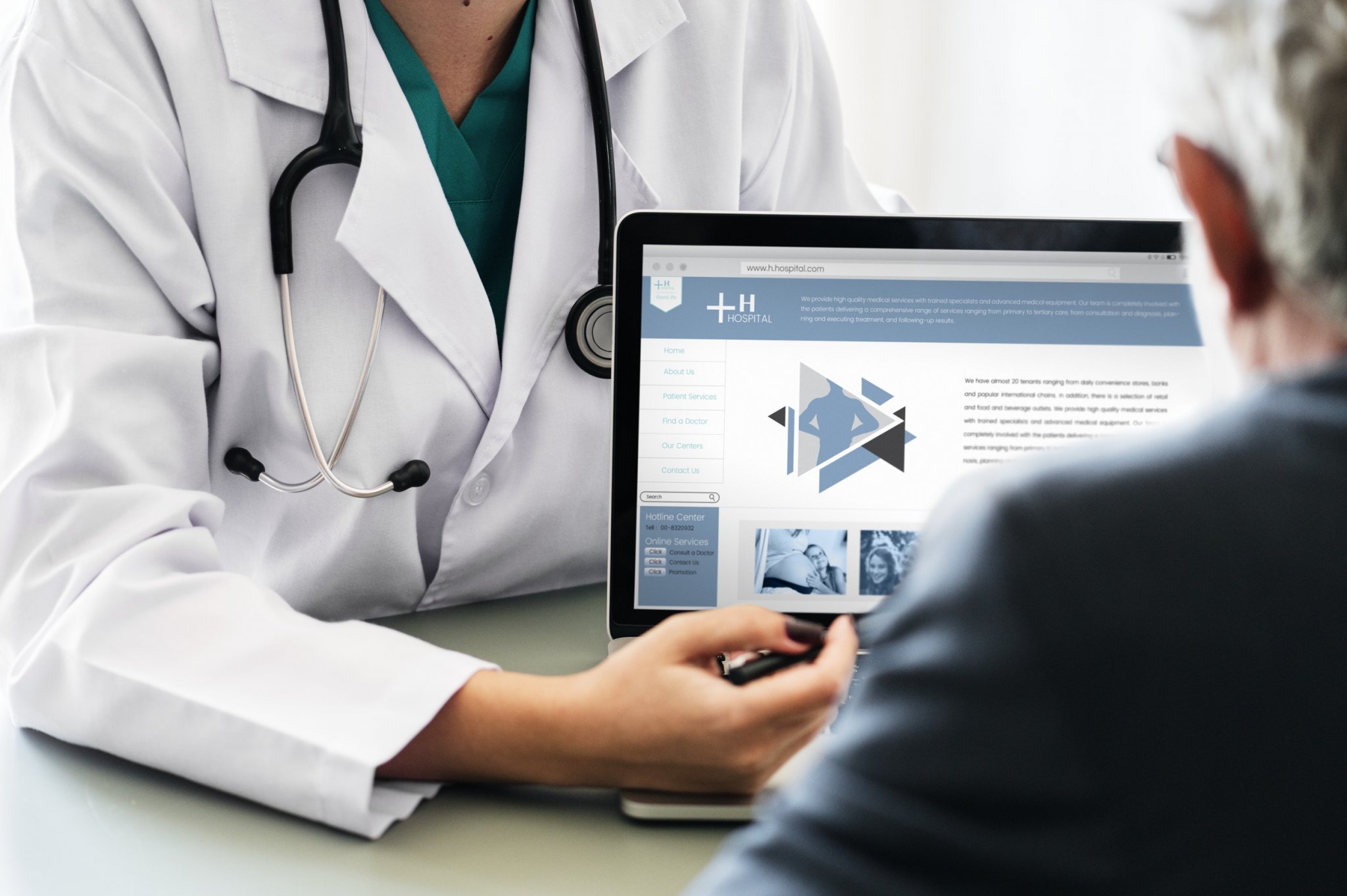 doctor showing a laptop to the patient