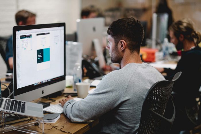 man on computer in office