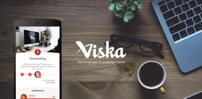 viska logo with phone showing viska on background with laptop and glasses
