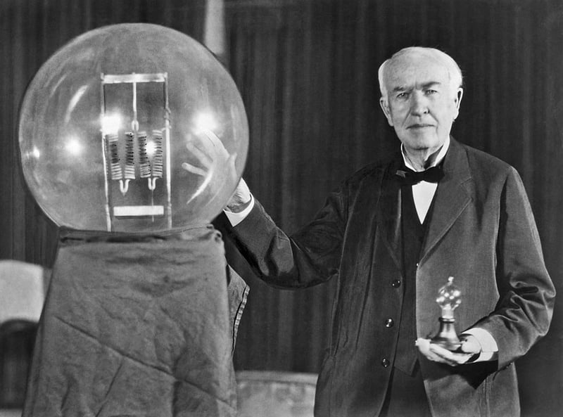 Noted inventor Thomas Edison at the lightbulb's golden jubilee anniversary banquet in his honor, Orange, New Jersey, October 16, 1929. He is exhibiting in his hand a replica of his first successful incandescent lamp which gave 16 candlepower of illumination, in contrast to the latest lamp, a 50,000 watt, 150,000 candlepower lamp.