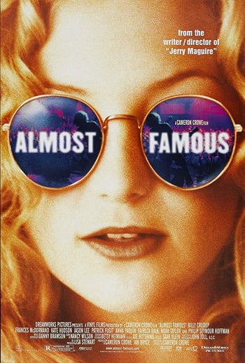 Almostt famous movie poster - close up of a blonde womans face wearing reflective sunglasses, white text overlaid