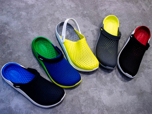 5 crocs shoes next to each other in various colors