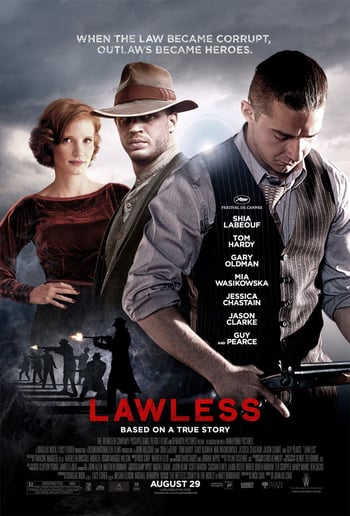 Lawless movie poster - two men and a woman wearing suits and a dress stand against a grey sky background, red text overlaid