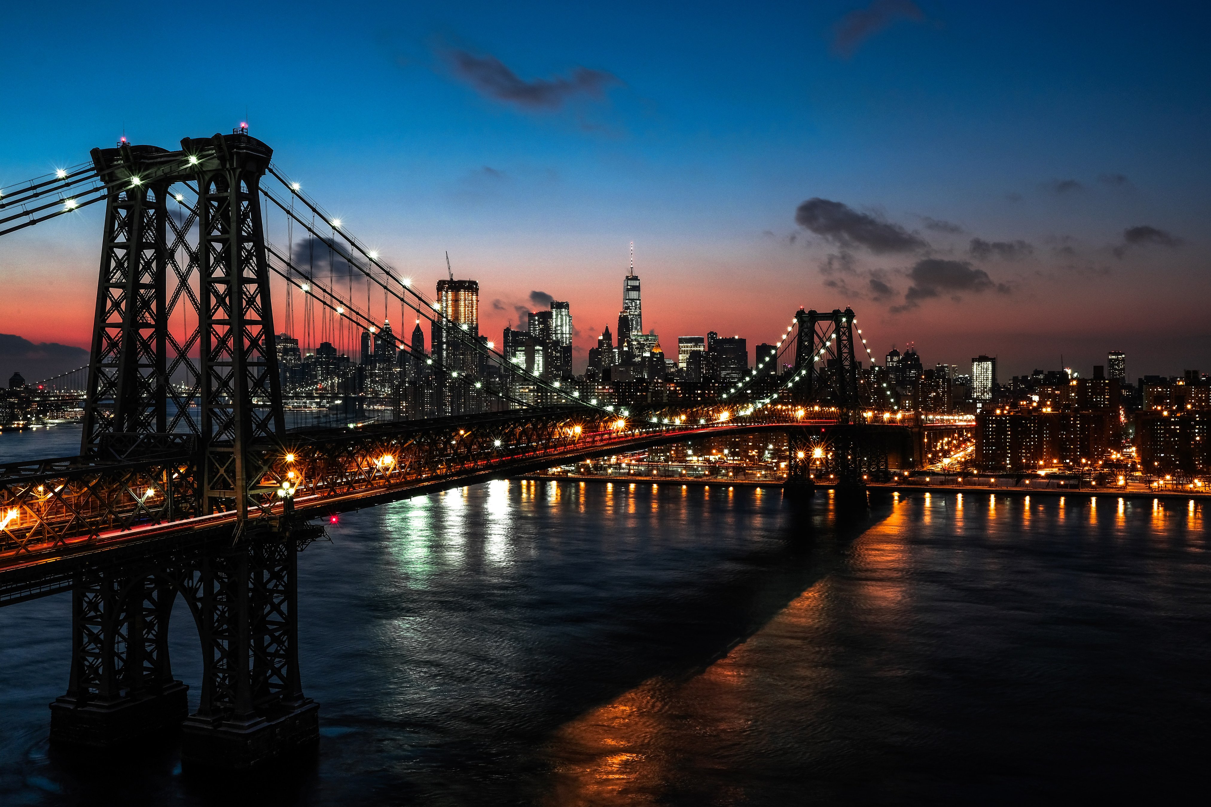 new york at dusk with view by the brooklyn bridge