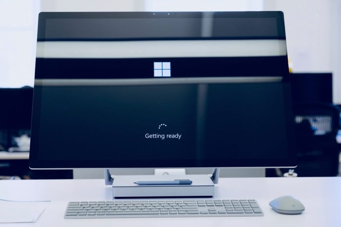 computer on desk with a keyboard and mouse