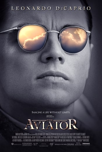 The aviator movie poster - close-up black and white image of a man wearing aviator sunglasses, reflected in the sunglasses is a cludy sky, white text overlaid