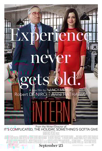 Intern movie poster - an old man and young woman wearing business clothes stand in an office, white and red lettering is overlaid