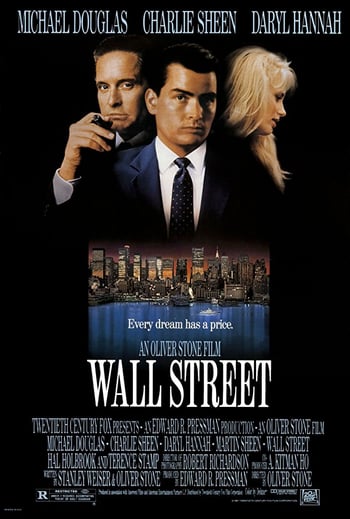 Wall street movie poster - two men in business suits stare into the camera as a woman looks away, separately a skyline of new york city at night is featured, all on a black background with white lettering overlaid