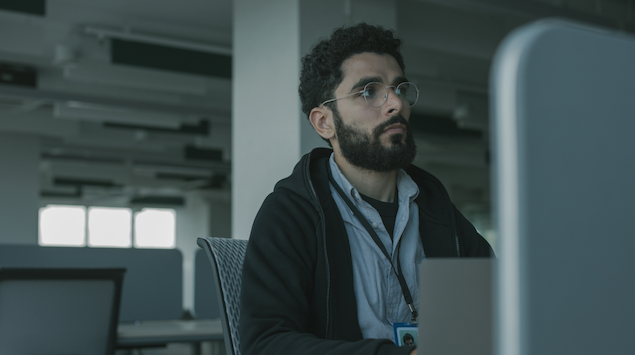 A man in front of lap top 