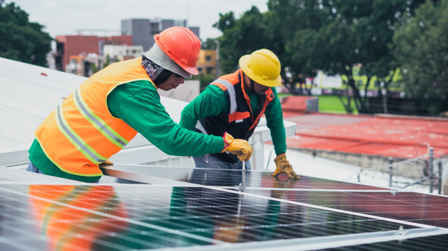 Men fixing solar panels 